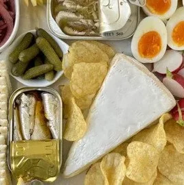 Delicious tinned fish board featuring an assortment of seafood delicacies.