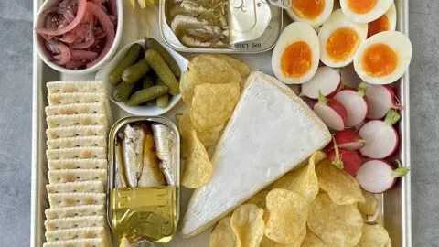 Delicious tinned fish board featuring an assortment of seafood delicacies.