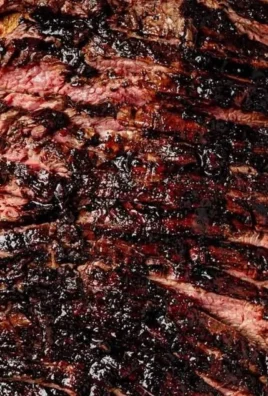 Balsamic flank steak served with grilled zucchini and whipped feta cheese.