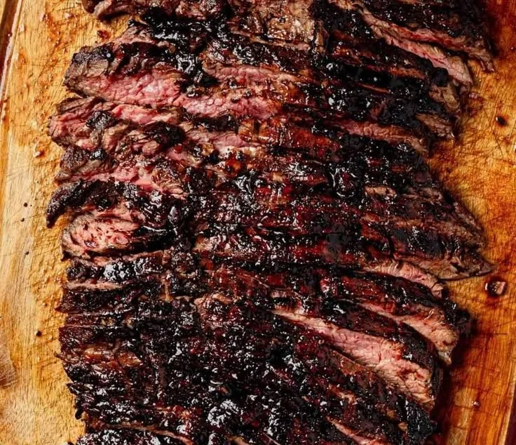Balsamic flank steak served with grilled zucchini and whipped feta cheese.