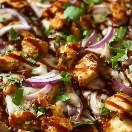 Delicious BBQ Chicken Flatbread Pizza topped with cheese and fresh ingredients