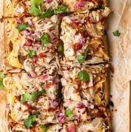 BBQ chicken flatbread pizza with BBQ sauce, chicken, and cheese