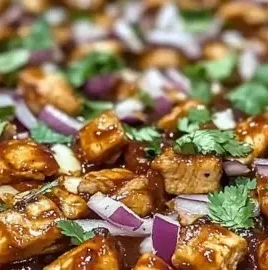 Delicious BBQ chicken flatbread pizza topped with cheese and fresh ingredients.