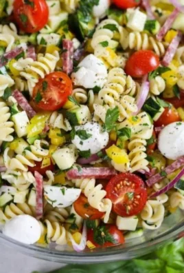Colorful pasta salad filled with fresh vegetables and vibrant ingredients.