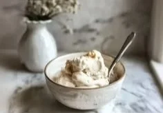 Cottage cheese ice cream topped with brown butter and vanilla in a bowl