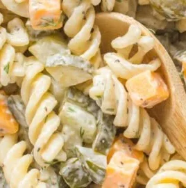 Delicious Dill Pickle Pasta Salad in a serving bowl with fresh ingredients.