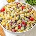 Bowl of easy creamy pasta salad featuring colorful vegetables and dressing