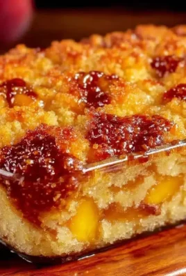 Easy peach cobbler dump cake recipe with fresh peaches and a cake mix topping.