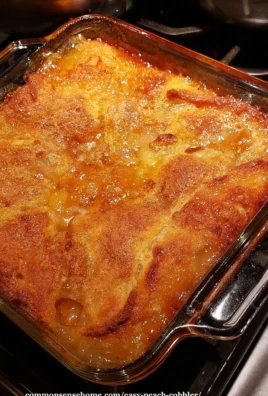 Delicious easy peach cobbler served in a glass dish