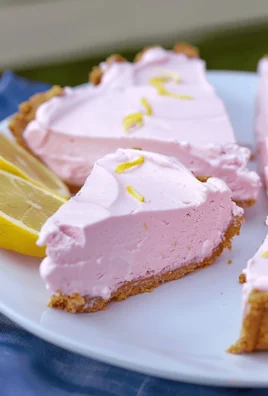 Delicious Frozen Pink Lemonade Pie served on a colorful dessert plate