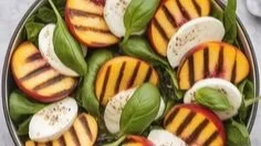 Grilled Peach Caprese Salad with peaches, mozzarella, and basil on a plate