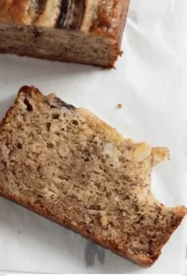 Slices of healthy gluten-free banana bread on a wooden cutting board