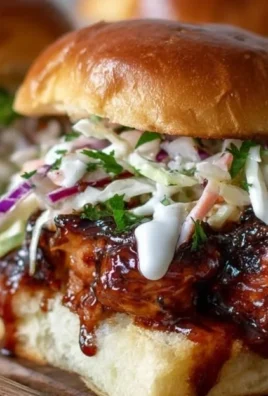 Honey Chipotle Garlic Chicken Sliders served with sauce and garnishes