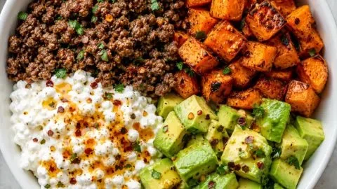 Hot Honey Beef Bowl topped with Cottage Cheese for a tasty and nutritious meal.