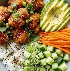 Delicious hot honey chicken bowls topped with fresh ingredients and drizzled with honey