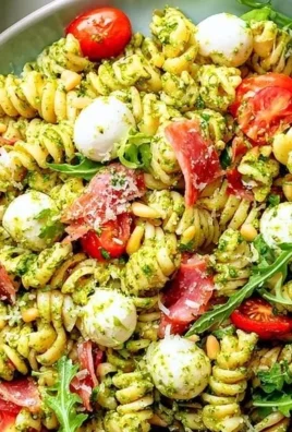 Italian Antipasto Pesto Pasta Salad with vibrant veggies and pesto dressing