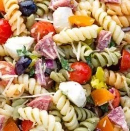 Italian pasta salad with fresh vegetables and herbs in a bowl