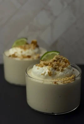 Delicious Key Lime Pie Cheesecake Bowl topped with lime zest and whipped cream