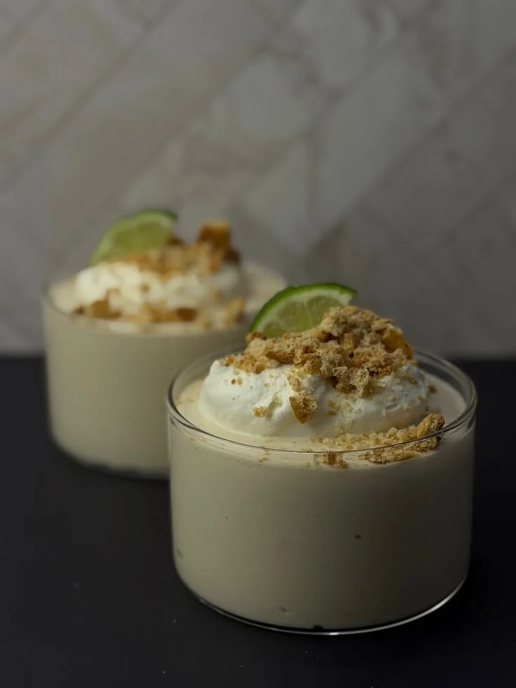 Delicious Key Lime Pie Cheesecake Bowl topped with lime zest and whipped cream