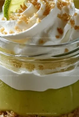 Homemade Key Lime Pie Jars, a sweet and tangy dessert in portable jars.