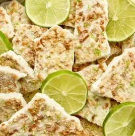 Delicious Key Lime Pie Yogurt Bark garnished with lime zest and cookie crumbs