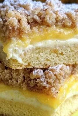 Freshly baked Lemon Coffee Cake with a lemon glaze on a white plate