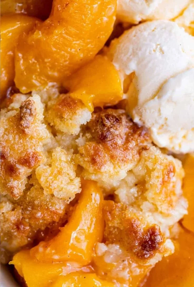 Homemade peach cobbler with fresh peaches and a golden crust