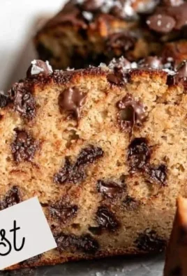 Healthy Protein Banana Bread sliced on a wooden board
