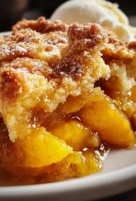 Deliciously simple peach cobbler served fresh from the oven.