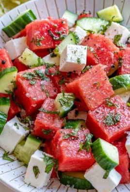 Refreshing watermelon cucumber feta salad served in a bowl