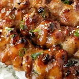 Delicious teriyaki chicken skewers served on a plate.